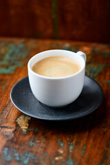 Cup of coffee on wooden background. Soft focus. Copy space