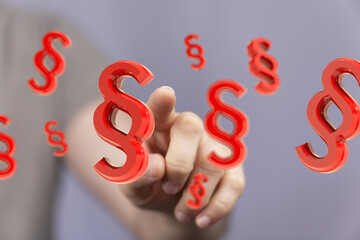 Abstract image of a hand interacting with 3D paragraph symbols, ideal for legal and justice...