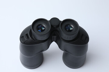 Vintage binocular isolated closeup on white background.