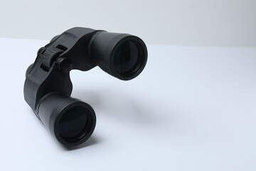 Vintage binocular isolated closeup on white background.