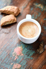 Cup of coffee and Cantuccini (Italian cookie) on dark wooden background. Copy space.	