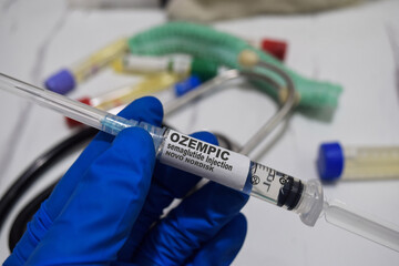 OZEMPIC semaglutide injection novo nordisk drug syringe in blue gloved hands. Medical concept