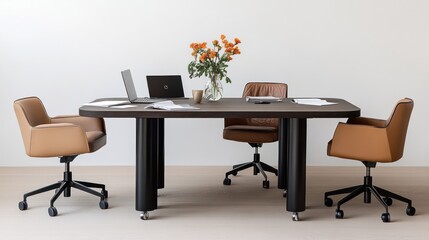 Modern conference table with chairs.  Light beige chairs, dark brown table with black supports, and a vase of orange flowers on the table.  Two laptops, papers, and a cup.  Neutral backdrop