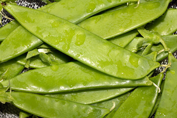 Close up of mange tout peas washed and ready for cooking