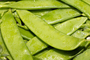 Close up of mange tout peas washed and ready for cooking