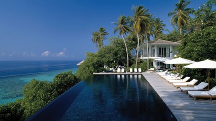 Luxurious infinity pool overlooking a tropical ocean.