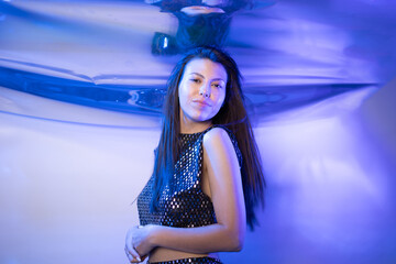 Girl Dressed as a Fabulous Mermaid in a Vibrant Underwater-Themed Setting During Nighttime