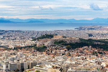 Aerial view Athens with Acropolis and harbor from Lycabettus hill in Greece.