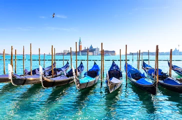 Wandcirkels Gondels Gondolas on the Grand canal in Venice, Italy. In background, on island of San Giorgio, is the Church of San Giorgio Maggiore with bell tower.  © preto_perola