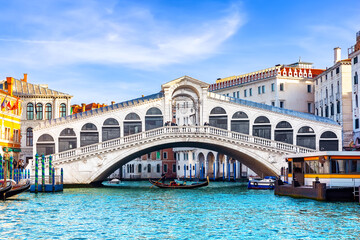 View of Grand Canal with Rialto Bridge in Venice, Italy. Landscape with  Rialto Bridge and gondola on the Grand Canal in Venice, Italy, Europe.