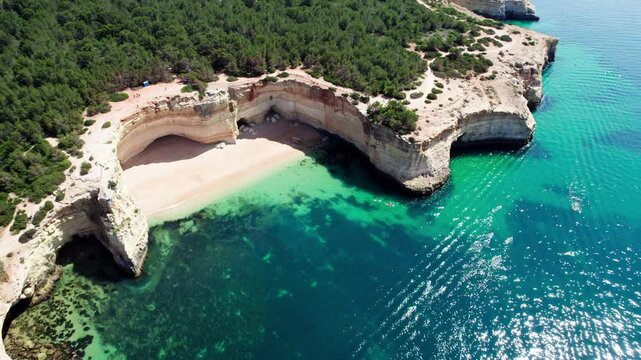 Overhead pull reveals Benegil Beach and Algave in Portugal