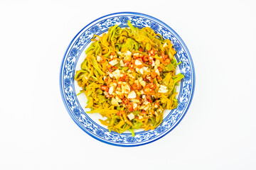 A dish of salad daylily on a white background