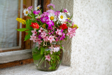 Beautiful bouquet of summer wild flowers in a green garden