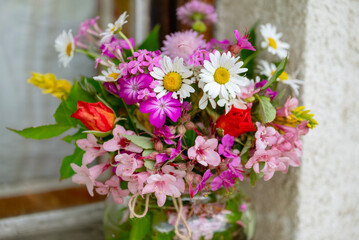 Beautiful bouquet of summer wild flowers in a green garden