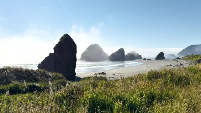 Beautiful sea stacks at Meyers Creek at the Southern Oregon Coast during foggy afternoon.