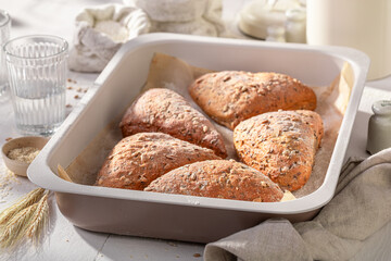 Healthy and hot triangular rolls in rustic bakehouse.