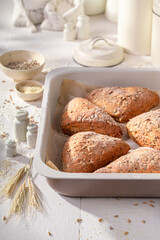 Healthy and hot triangular rolls freshly baked in home bakery.