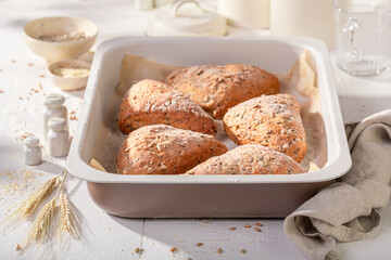 Tasty and brown triangular rolls baked in a bakehouse.