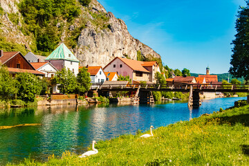 Spring landscape on a sunny day with reflections at Essing, Altmuehltal, Kelheim, Bavaria, Germany