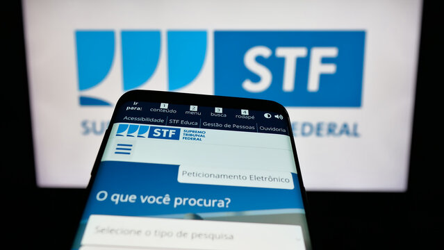 Stuttgart, Germany - 06-09-2025: Mobile phone with website of Brazil court Supremo Tribunal Federal (STF) on screen in front of logo. Focus on top-left of phone display.
