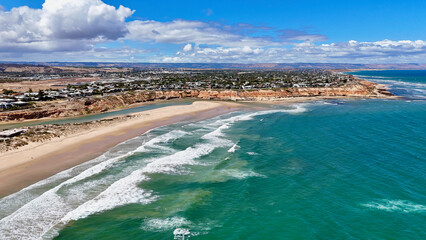 Southport Beach and Onkaparinga River, South Australia: Aerial Drone Image Featuring River Mouth, Sandy Beach, Red Cliffs, Turquoise Waves, and Coastal Suburbs Along the Fleurieu Peninsula