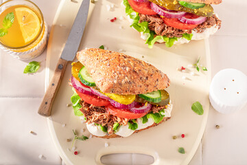 Fresh and delicious sandwich served with lemonade in the kitchen.