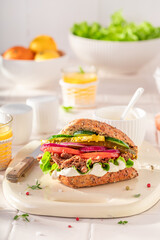 Fresh and delicious sandwich with beef and vegetables for breakfast.