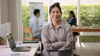 The way forward save the planet earth Gen Z female asia people go green net zero waste ESG office desk. Portrait headshot face young adult woman asian SDGs auditor work look at camera smile happy.