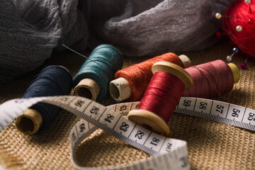 Sewing and tailoring concept. Spool of thread with needle	