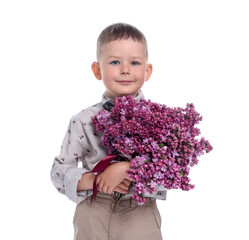 Little boy with bouquet of lilac flowers on white background