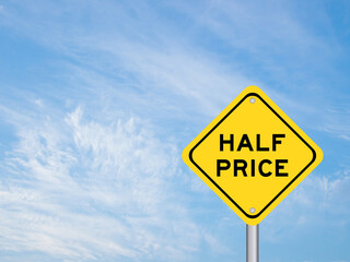 Yellow transportation sign with word half price on blue color sky background