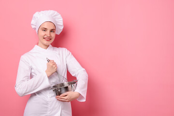 Confectioner in uniform with whisk and cooking pot on pink background, space for text