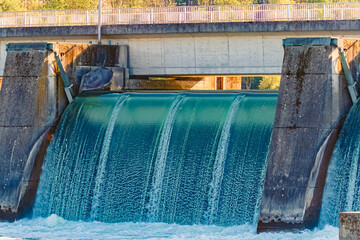 Spring landscape with an open river weir on a sunny day at Landau, Isar, Dingolfing, Bavaria, Germany
