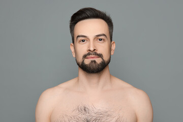 Handsome man before shaving on grey background
