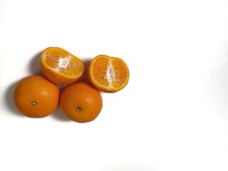 Orange fruit and half isolated on the white background