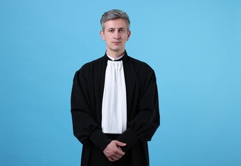 Portrait of judge on light blue background