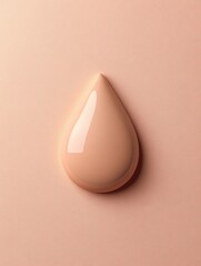 Fototapeta premium Smooth drop of nude paint on a pastel background.