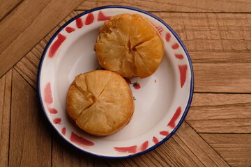 fried cassava on a zinc vintage plate. Cassava is a staple food and one of the sources of...