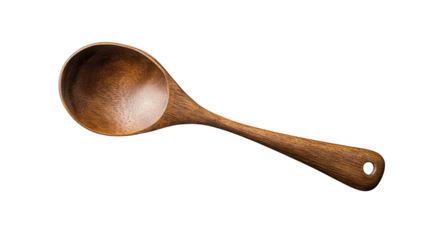 Craftsman shapes a beautiful wooden ladle in a cozy workshop, showcasing the artistry and intricacy of traditional woodworking techniques in the afternoon light.