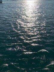 sea waves on the sea with sun reflection 