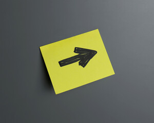 Bright yellow sticky note with arrow pointing right