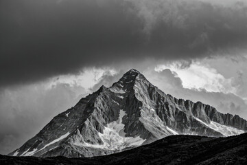 A black and white photo of a snowy mountain landscape