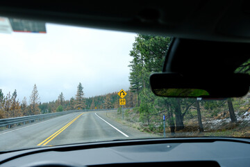 Road Trip adventure, point of view from the drivers perspective with windscreen, driving through...