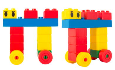 Isolated photo of construction block toy creature on white background.