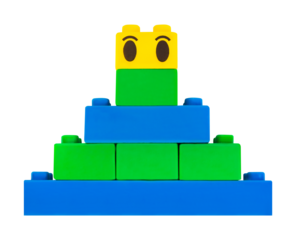 Isolated photo of construction block toy pyramid on white background.