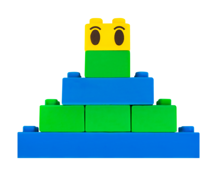 Isolated photo of construction block toy pyramid on white background.