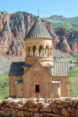 Church and beautiful natural landscape. Monastery in nature. Armenian Apostolic Church Noravank. Beautiful architecture of the church. Monastery against the backdrop of rocky mountains. Christianity i