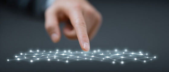 Hand interacts with glowing digital network, symbolizing technology and connectivity