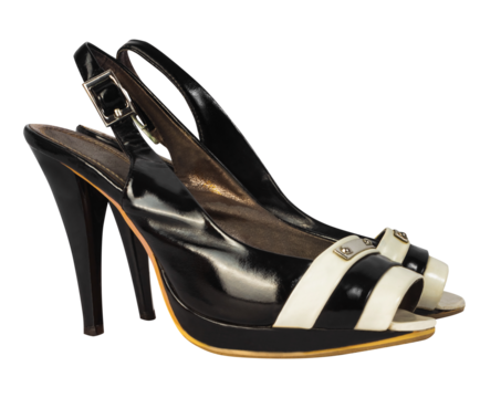 Isolated photo of black polished leather high heeled woman sandals on white background.