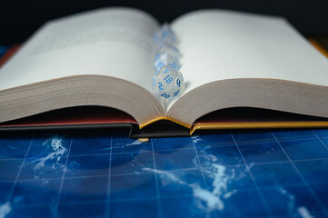 D20 dice on an open book — a symbol of tabletop games, fantasy, and Dungeons & Dragons. Perfect for RPG themes, storytelling, and adventure.